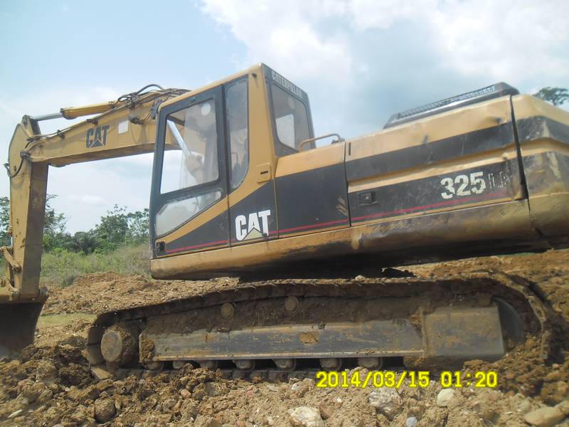Excavator Caterpillar 325 on mining site in Ghana