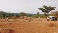 Tailings heaps in background on mineral processing site