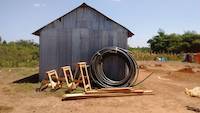 Wooden sawhorses, the HDPE pipe and timber on the site