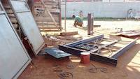 The screen or classifier being straightened by metal worker