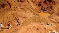 The path to the open pit is blocked with the excavated soil