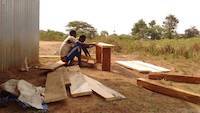 Workers preparing bench and desks as open-air furniture