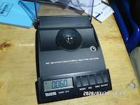2020-03-30, 0.060 grams of natural gold nuggets on the balance scale