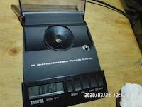 2020-03-28, 0.060 grams of natural gold nuggets on the balance scale