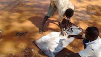 The vortex matting is being washed to dissolve any water tension