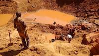 Miners working on the open pit