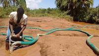 Miner working with hydro-nozzle in Uganda