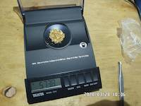 2020-03-28, 5.738 grams of natural gold nuggets on the balance scale