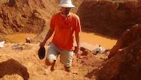 Mr. Jean Louis prospecting on the open pit
