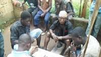 Miners playing cards, after the day of recovery of gold