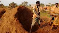 Mr. Okedi feeding the sluice