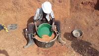 Mr. Okedi prospecting for gold on the open pit near Amonikakinei, Tiira, Busia, Uganda