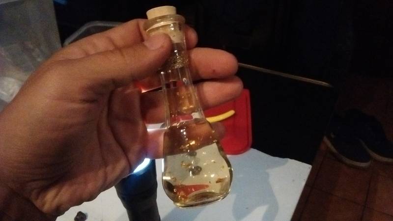 The spirit bottle with golden flakes