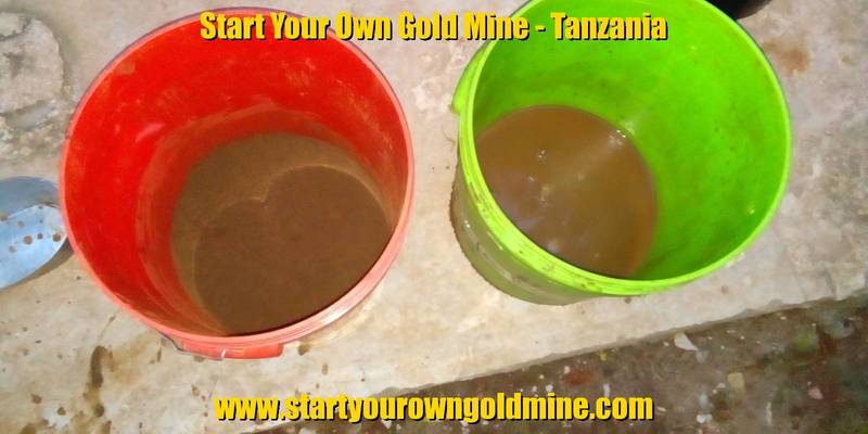 Black sand sorted in buckets by their size