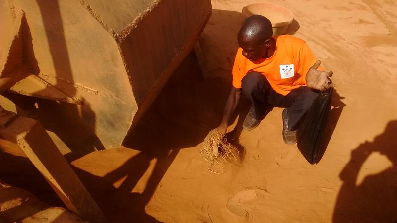 Miner scooping the crushed material