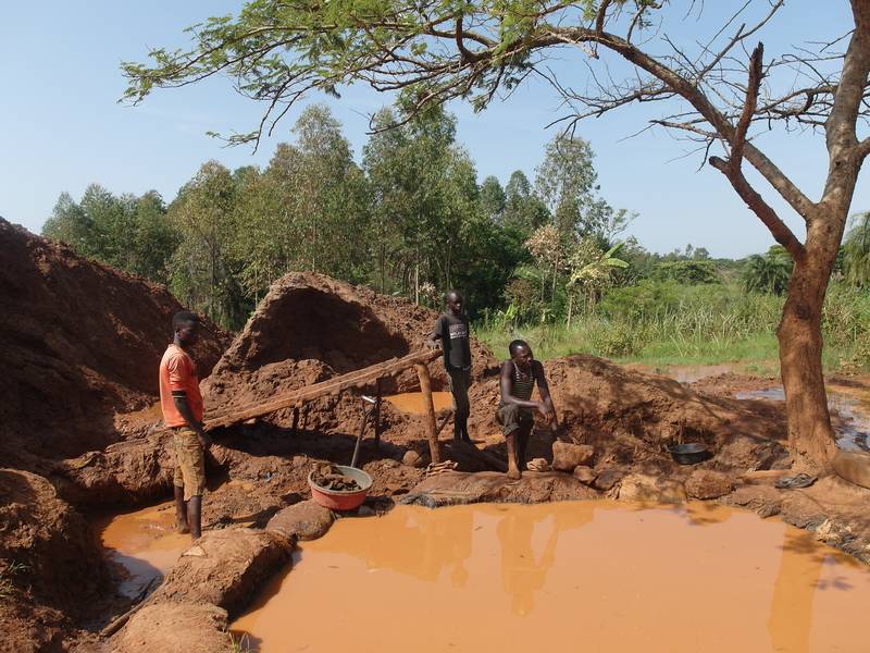 Miners processing tailing in Uganda
