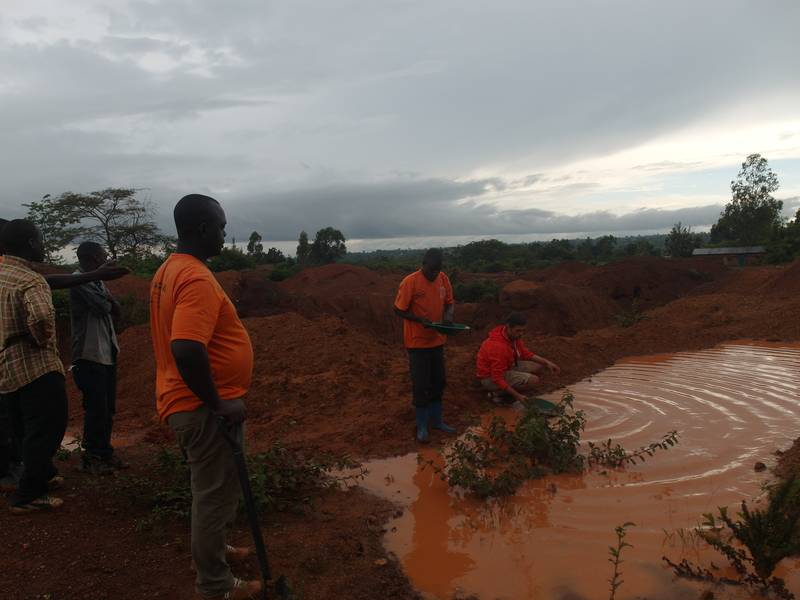 Mr. Louis gold panning on the open pit