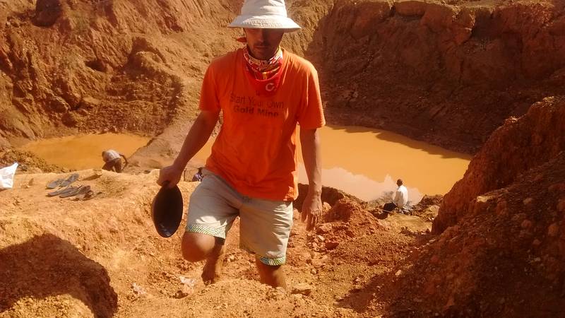 Mr. Jean Louis prospecting on the open pit