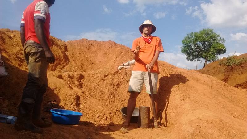 Mr. Louis showing rocks before crushing it with the mortar and pestle