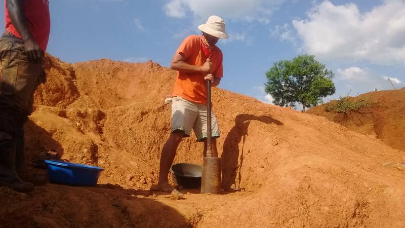 Crushing the rocks with mortar and pestle