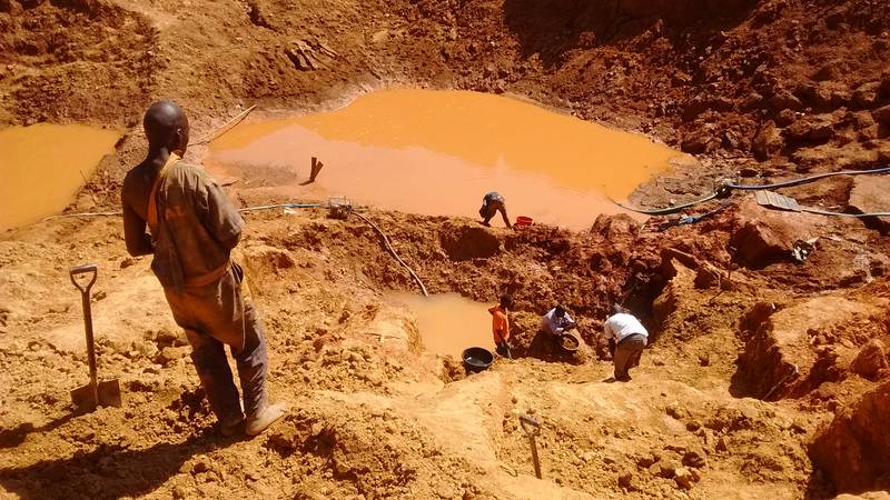Miners working on the open pit