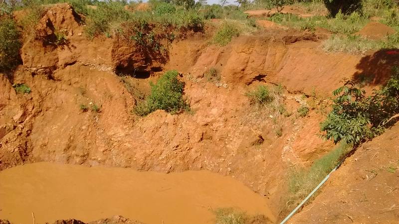 Layers of rocks visible in the open pit