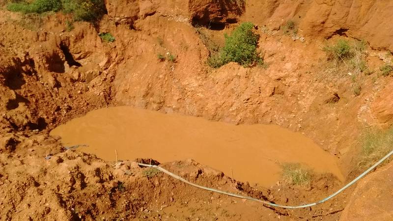 The layers of rock in the open pit