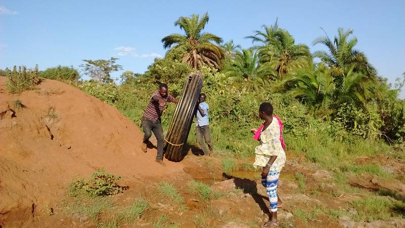 Moving the HDPE pipe to the river