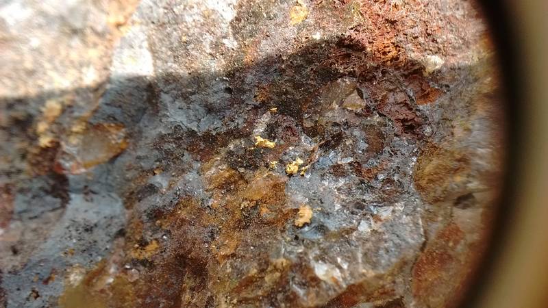 Gold particles on the rock