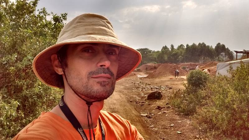 Mr. Louis with tailings heaps in background