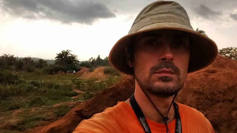 Mr. Louis in front of the heap of tailings