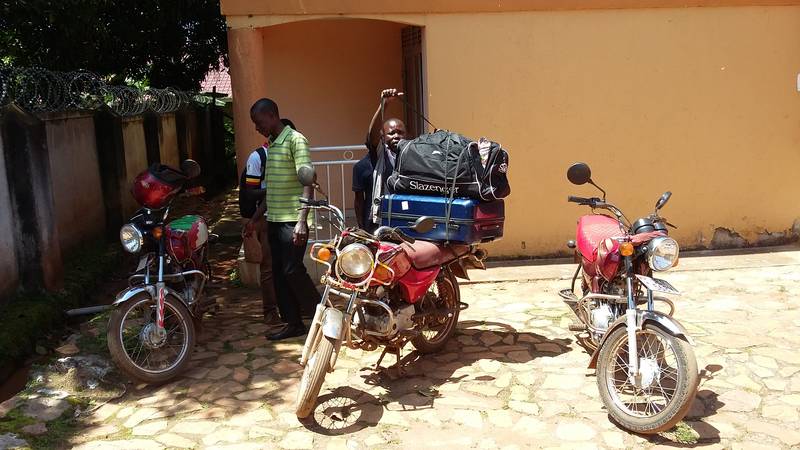 Quick bodaboda transfer of stuff in Entebbe, Uganda