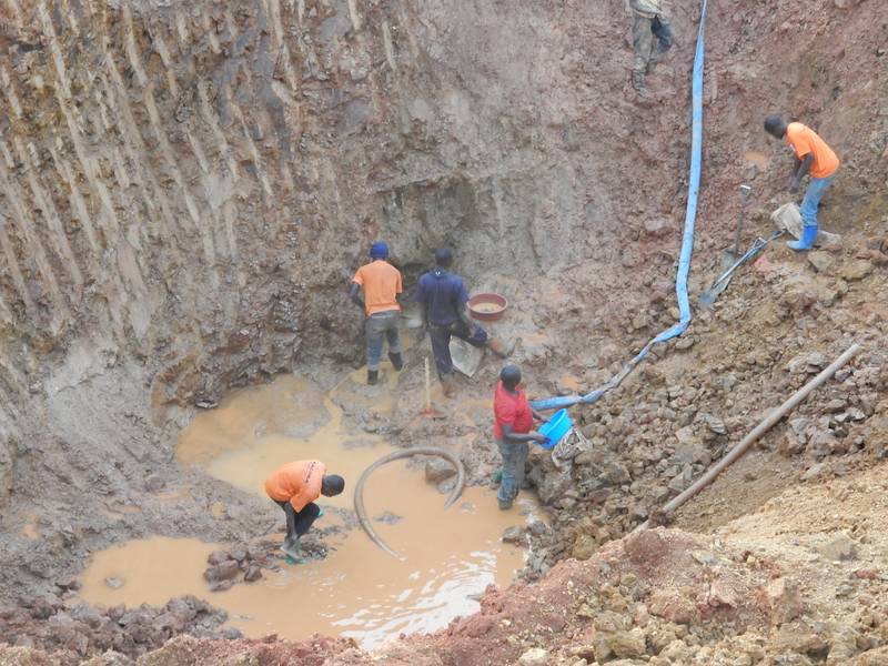 Miners working hard to reach the rich gold ore vein
